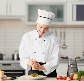 Female chef preparing in kitchen