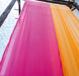 colorful fabric hanging to dry after traditional dye process,shot in Heng Dian Town,Zhejiang province of China.